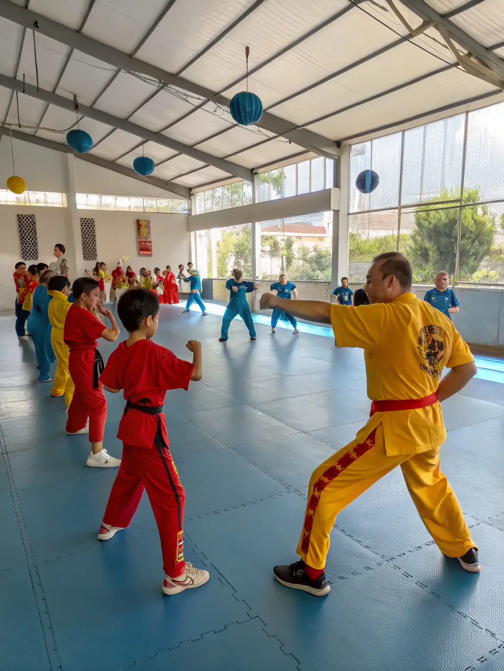 A serene image of students practicing traditional Korean martial arts forms, emphasizing the grace, precision, and cultural heritage of these disciplines under the guidance of a master instructor at Severac Taekwondo.